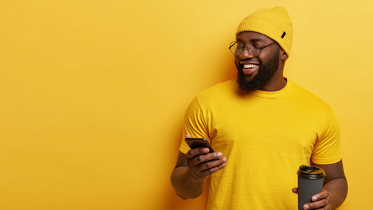 man laughing at phone meme